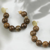 Perles en bois "ailes de poulet" 8mm