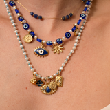 Pendentif médaille oeil 11x13mm